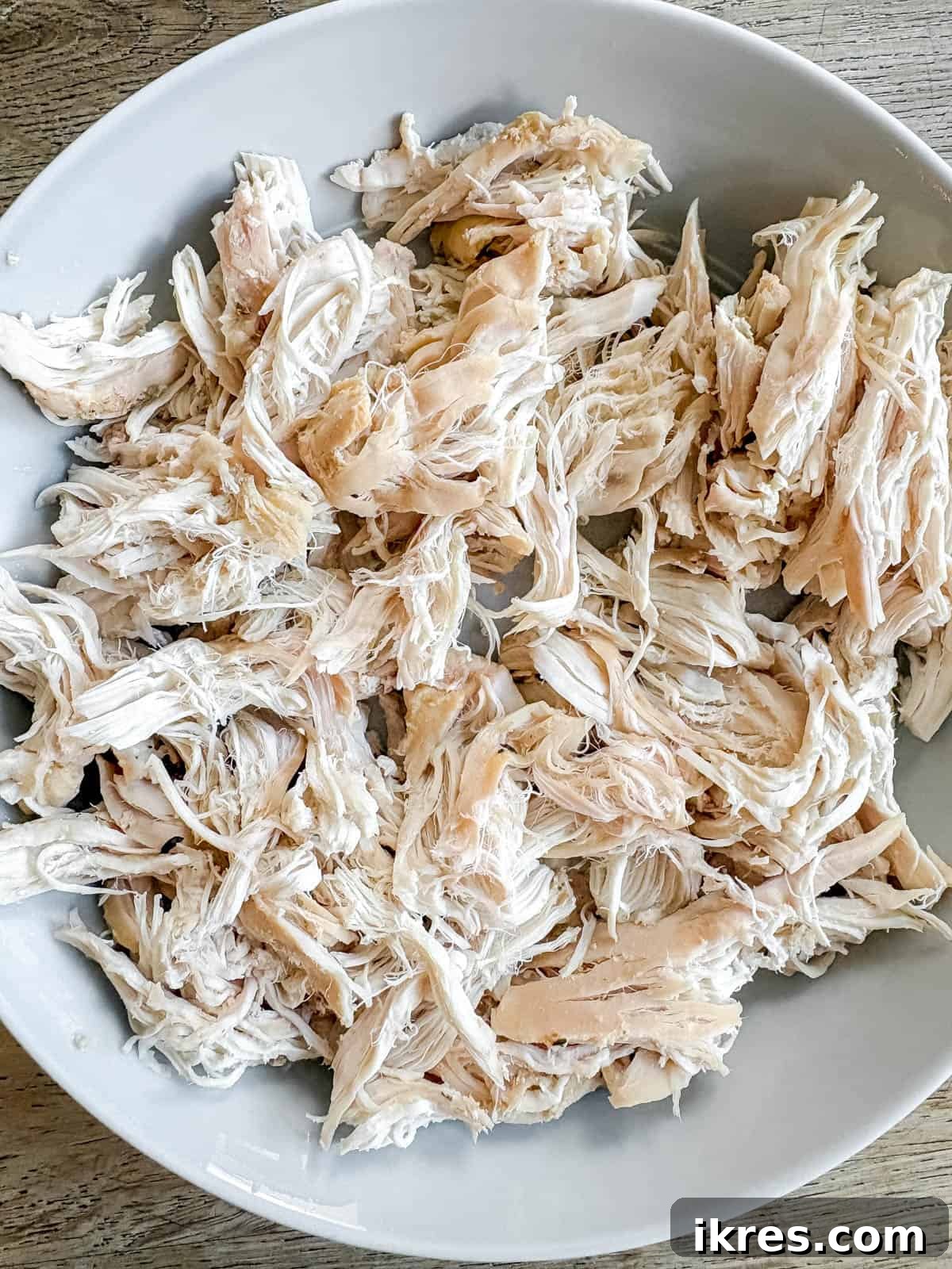 Shredded chicken breast on a plate.